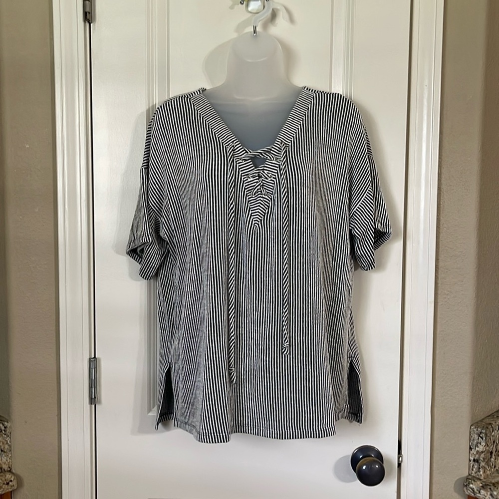 Black and white top with lace up neck line size L